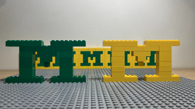 Picture of large yellow and green lego M figures